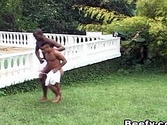 Black beefy gay licking the body and fingering his ass while licking again. Hardcore analsex with nasty cumshot. Action done outside and in the garden's grass field.