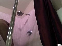 Nikita Von James is now in the shower and film herself again teasingly soaping her luscious body and her firm huge titties and posing in front of the cam caressing her pussy.