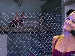 Alexis is sucking off the MMA champ in the cage and she is doing a great job of it. The blonde announcer is calling the shots and making the hot brunette suck that cock, until it cums. Will she make him explode?
