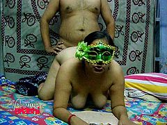 This chubby Indian whore is super horny! She's not afraid to show off her big tits and ass, but she keeps her face hidden. She gives him head and then, bends over in front of him, to take his hard cock from behind.