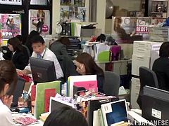 Hot Asian milf getting her face fucked in a kinky office orgy