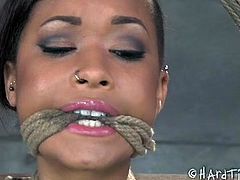 Crucified ebony porn model is punished in BDSM sex clip