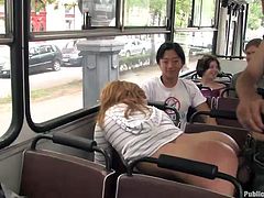 She has her boobs grabbed in public, but she doesn't mind. She is going to show how good she is at giving handjobs and blowjobs right on the bus. She is pounded from behind and sucks on his balls, as the fellow passengers look on.