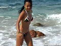 Watch this hot bombshell babe in bikini, running around the beach and enjoying this nice surroundings. See her tight body, as she is showing it to you with very tease-full attitude and making you crave her more. That tight bubble butt is sure something to dream about all night long!