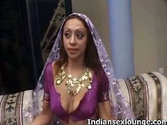 Indian amateur is wearing a traditional costume and starts removing it one by one baring her fine firm boobs. Her partners started spreading her pussy and got fucked in doggy.