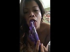 Horny Asian Striptease and Sucking Her Dildo