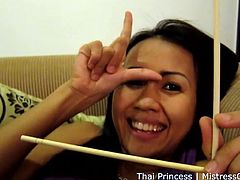 This mean Thai princess is in charge and she is going to hit your cock and balls with her chopsticks. You better do as she says, otherwise it will be even more painful. She grabs her boobs under her shirt and flashes her panties, but she does not give you permission to masturbate.