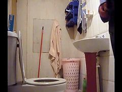 Beautiful brunette in the toilet bathroom hidden cam voyeur