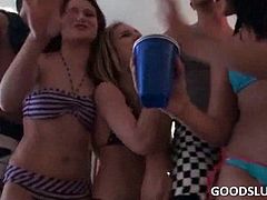 Naughty girls drinking and playing sex games at a hardcore orgy party