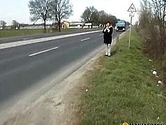 On the sidewalk, a woman pissing