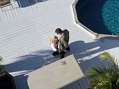 Mouth -watreng blonde Olivia Austin in white blouse and black bra goes topless while giving outdoor blowjob by the pool. She polishes hard dick with her hot lips right in the sun.