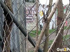 Raven haired dirty teen loves pissing on wire fence