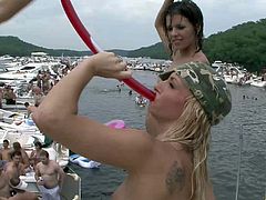 Party time on the lake has lots of topless amateur cuties