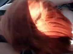 Redhead fucking in car