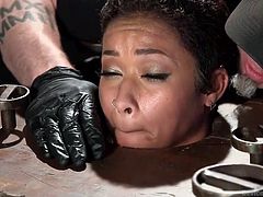 The slutty ebony bitch trapped in the merciless executor's dark basement, cannot help herself, wondering what kinky game he's up to now! Click to watch the naked slut with small lovely tits and tattooes bonded strongly. Don't miss the inciting details.
