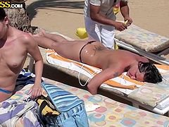 Three hot amateur babes expose their sexy bodies in the sun, at the beach side. One naughty lady is enjoying a relaxing massage, while her slutty companions tan. See them eating pussy and playing with dildos!