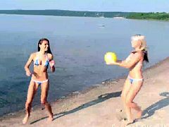 Teen beach babes with natural tits flirting and touching outdoors