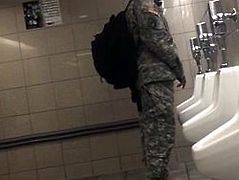 Soldier hardon in public bathroom.