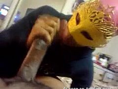 This guy is getting a blowjob from his girlfriend, which is awesome no matter how and where it happens. She's a little kinky though, or just doesn't want to be seen on camera, because she stays concealed the whole time. She wears a mask like you'd see in a Mardi Gras parade or a masquerade.