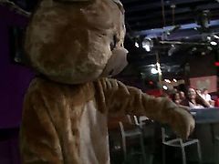 A dude is dancing for some women in his bear costume. The girls rip if off the stripper and then they jump on him to have sex. He has a fun job.