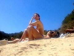 four topless teens at the beach