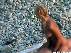 blonde babe caught riding cock on the beach