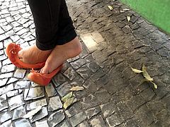 Candid girl feet in street