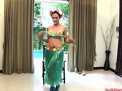 Ladyboy Cindy dressed in a Hawaiian grass skirt and lacy green pantyhose. She does a little dance swaying her hips then strokes her big dick. Cindy impales herself fully on a large realistic dildo and sucking cameraman's dick.
