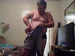 Guy cutting off his clothes