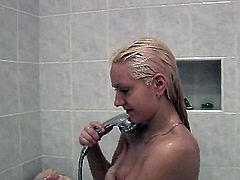 Cute blonde girl with perky tits and clean pussy shows every inch of her lovely nude body as she takes a shower. She is all wet and dangerously sexy! Dick-hardening video!