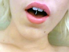Busty blondeLily Lebeau spreads her pussy lips with a huge dildo and also fingers herself. She has such a cute face and nice natural tits with piercing on them.
