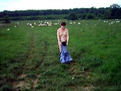 Small titted milf walking nude with the sheep