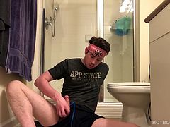 He pulls that big stiff dick out the leg of his shorts and lets it pop out the waist band, as he edges himself a few times. Finally, the young man removes the shorts and continues his jerk off, wearing only a t-shirt. Cole eventually reaches his goal and spews a cum gusher that drips from his hand to the floor. Then he licks his fingers clean and gives the camera a big smile.