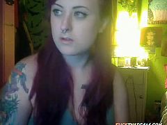 A beautiful redhead emo girl with big boobies strokes and sucks the small penis of her partner and takes its cum in her mouth in front of the webcam.