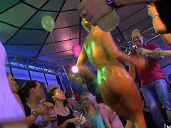 She gets up on stage and strips down to her Birthday suit, showing everyone her big natural tits and her bubble butt that some guy runs up to and buries his face in her butt crack as he performs the motorboat for a cheering crowd.