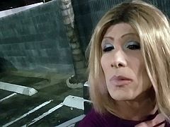 Crossdresser smokes VS120s in parking lot