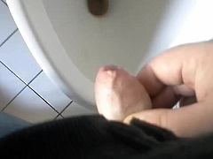 Small erect uncut willy wanked to climax at a urinal