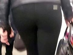 Hot woman with round ass in black pants
