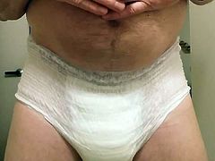 Playing with my soaked diaper and then wetting