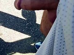 Taking a pee outside with a hard cock