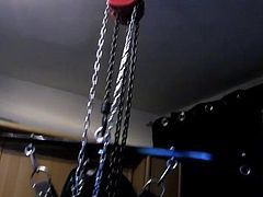 Hanging bondage in full rubber