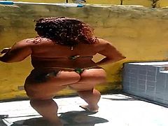 Crazy Dinha dancing poolside