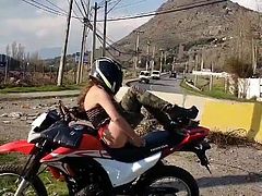 dirt bike chick fucks herself with bottle next to highway