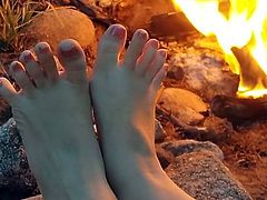 Cum on toes by the campfire