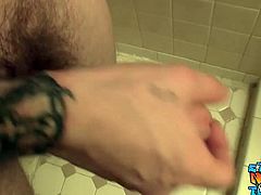 Thug with tattoos stroking his big dick in bathroom