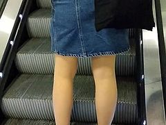 Pantyhose and sneakers on the escalator