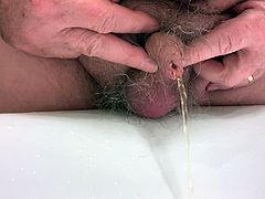 My good friend Don's lovely little uncut willy pees close-up