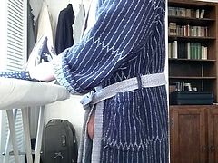 Ironing in bathrobe