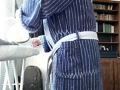 Ironing in bathrobe