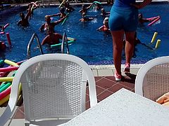 Exciting big  round fitness ass by the pool.